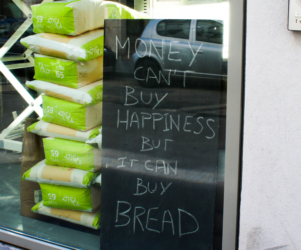 Money can't buy happiness but it can buy bread